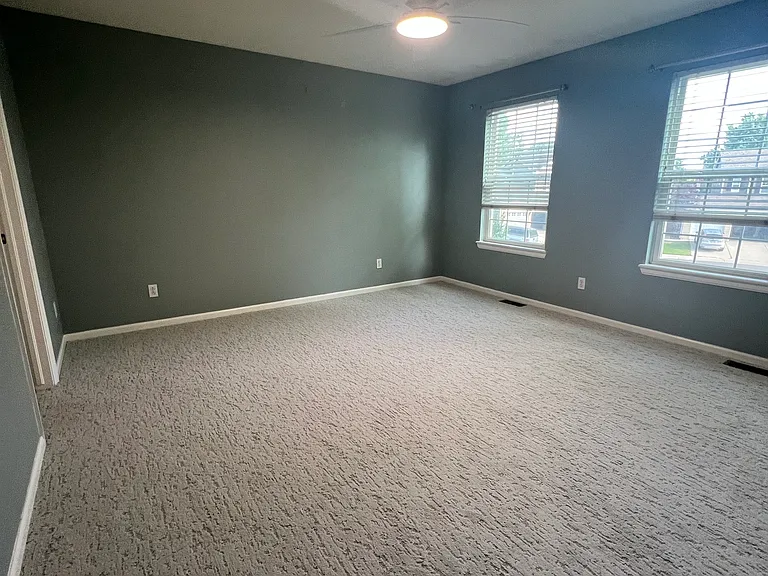 This is the primary bedroom, but the paint color is more accurate in the previous picture. This shows the new carpet.