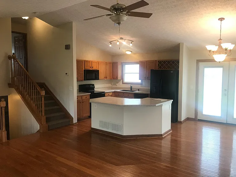 Kitchen & stairs to bedrooms
