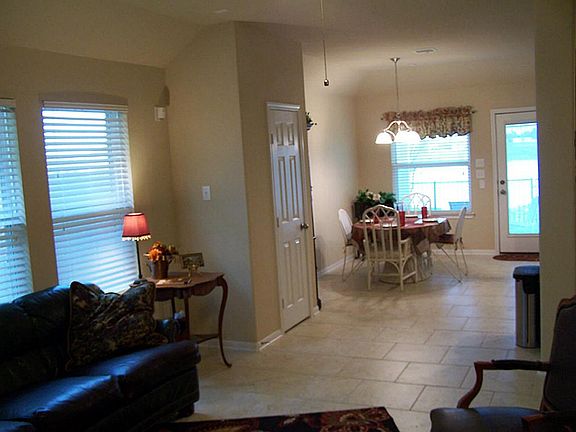 View of breakfast room and lake from den.  All tile.