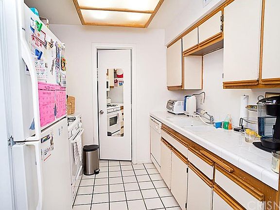 Kitchen with dishwasher and lots of storage.  Storage room right off kitchen.