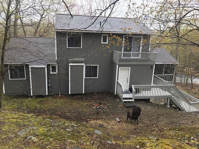 Main entrance to home is located after you go up the stairs to the back side. This is the view from the back side