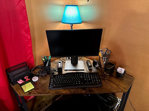 Workspace with monitor, keyboard and high speed internet connection.