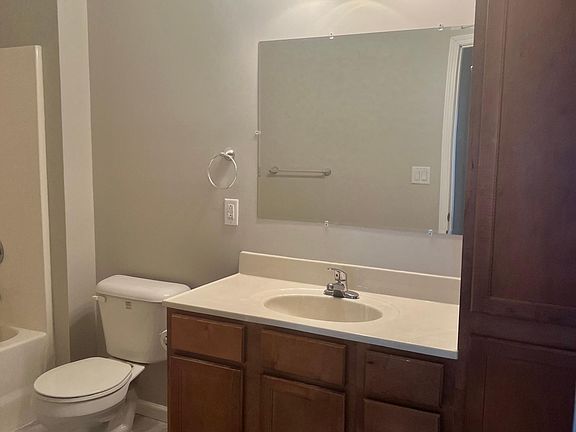 Tub shower combo, plenty of storage cabinet space & luxury vinyl tile flooring in both master & supporting bathrooms.