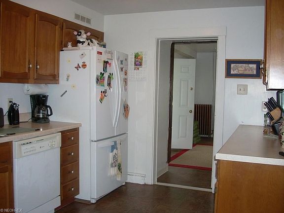 Kitchen leads to breezeway that goes to the utility room and garage.