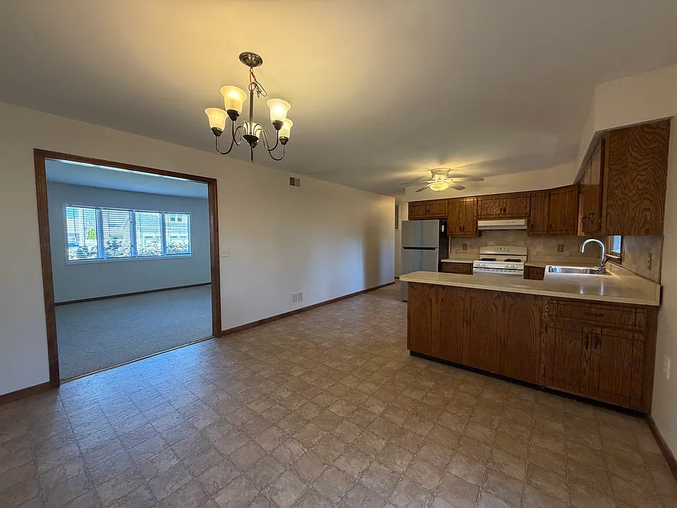 Dining room looking to living room and kitchen