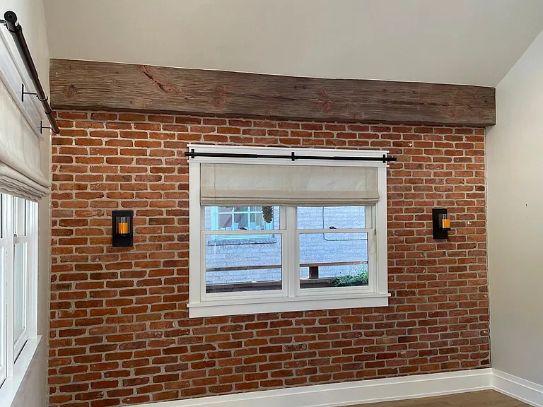 Family room with exposed brick