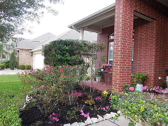 Beautifully landscaped front yard with fresh spring flowers