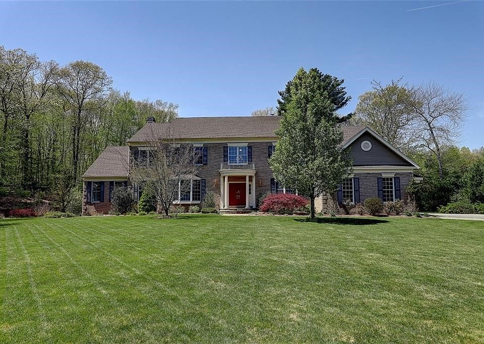 Brick-front Colonial. Built 2005. 4700 Sq. Ft. Living Above Ground. 11 Rooms, 4 Bedrooms, 3.2 Baths. 3 Car attached Garage. 1 Ac