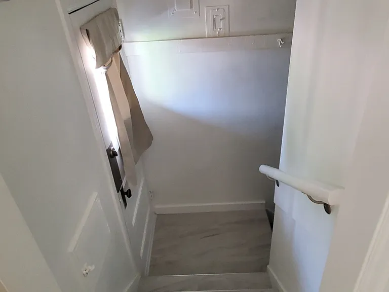 Stair well to backyard and downstairs