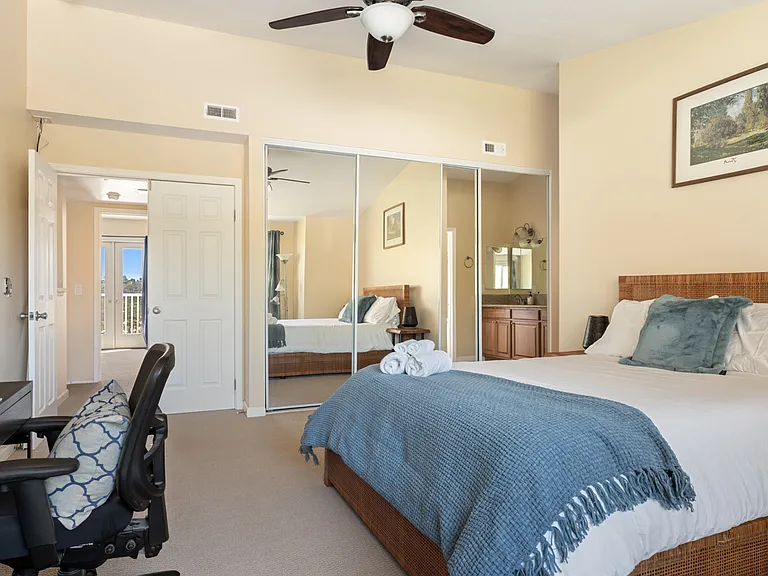 Serene primary suite with plush queen bed.