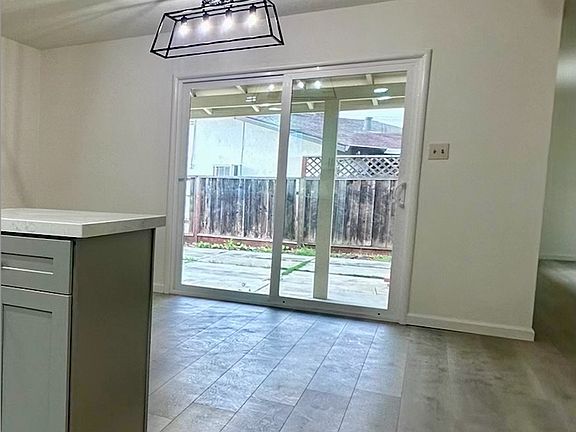 view from kitchen to dining area, lots of natural light
