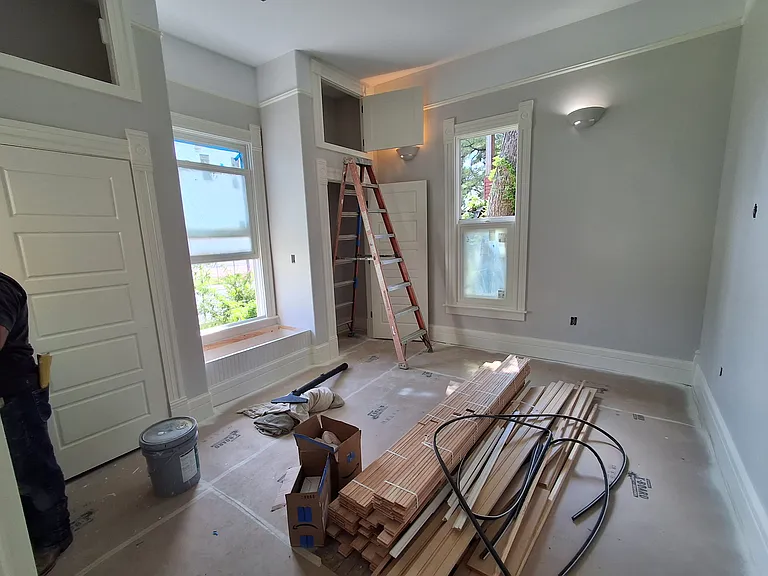 Front bedroom July 22. All painted. Doors in. Original floor under paper waiting to be sanded.