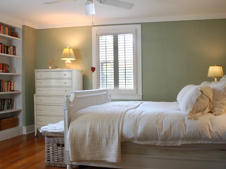 primary bedroom w/ built-in shelves