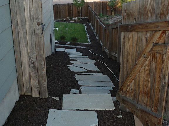 Custom cut flagstone walkway to the back yard...