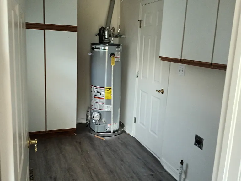 laundry room with cabinets