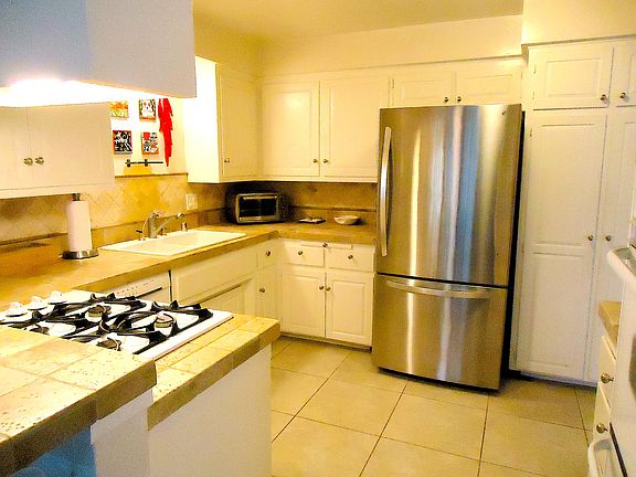 LARGE KITCHEN WITH UPGRADED APPLIANCES, LOTS OF CABINETS, TILE FLOOR