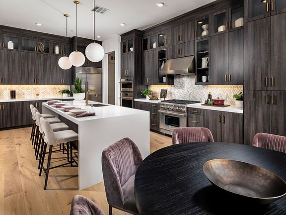 An image of the kitchen and dining space in the Villas Plan 5 model home.