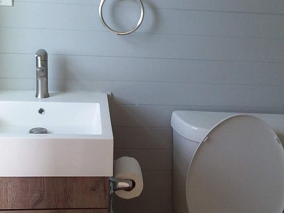 Compact but full bath. Stand up shower