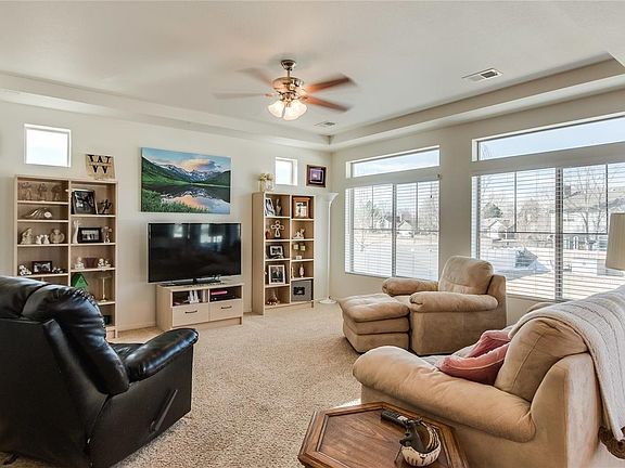 Main floor living room area with lots of windows and natural light