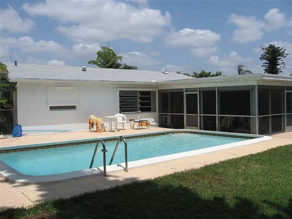 Swimming pool with huge screen enclosed patio