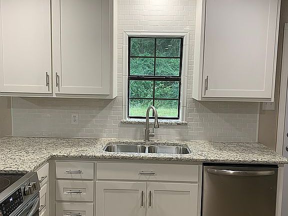 Tile backsplash to ceiling. 