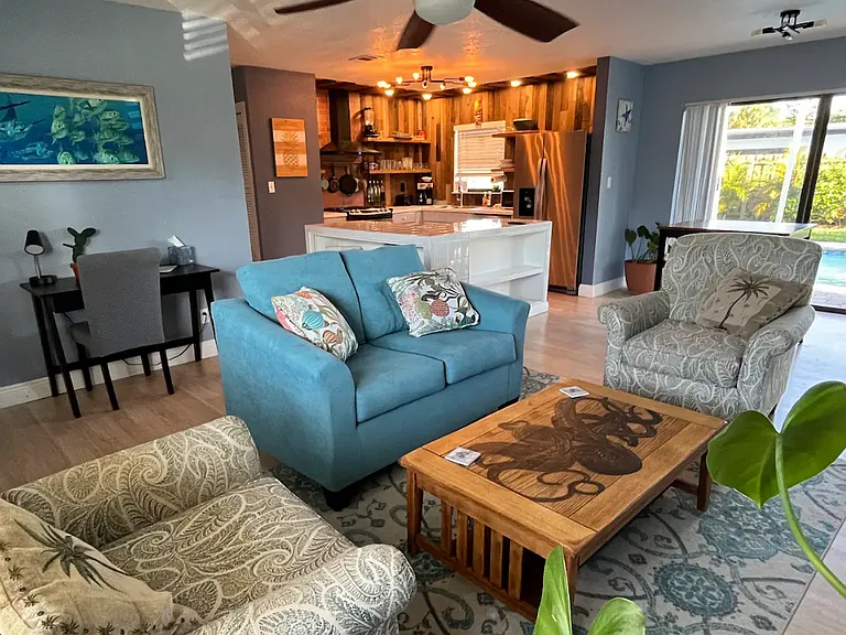 Living room with love seat and two sitting chairs