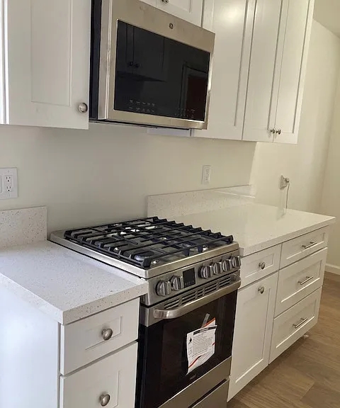 Stainless steel microwave and range are new.