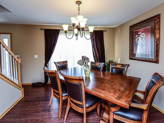 Formal dining room with beautiful wood floors and lots of light.