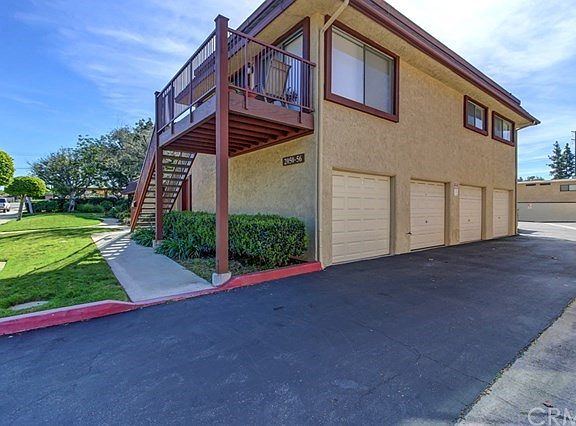 Side of home and one car garage