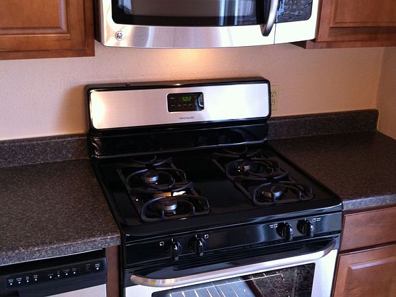 New stainless gas oven and range and built-in microwave / vent combo