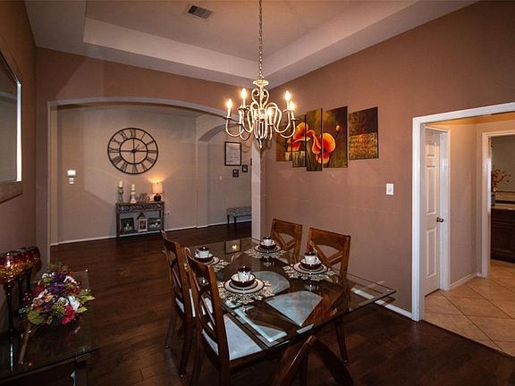 another view of Formal Dining hallway to right has laundry and large pantry and then kitchen