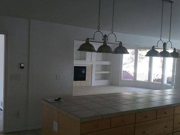 KITCHEN ISLAND AND FAMILY ROOM