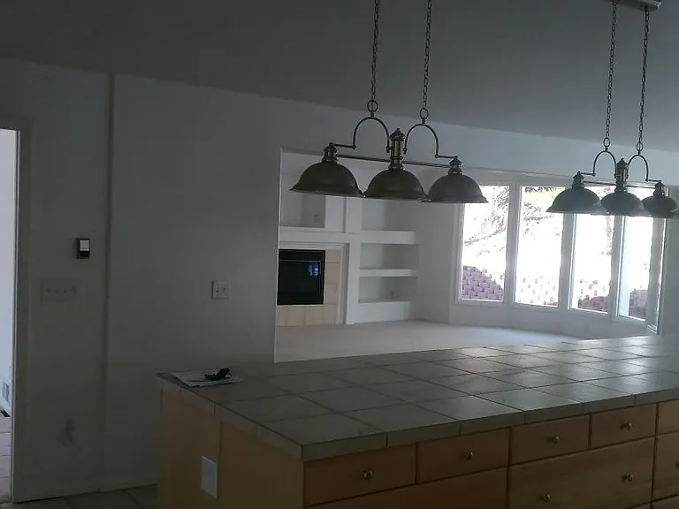 KITCHEN ISLAND AND FAMILY ROOM