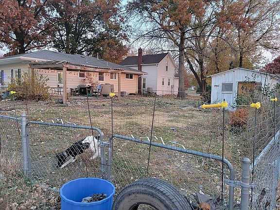 HUGE FENCED YARD WITH SHED