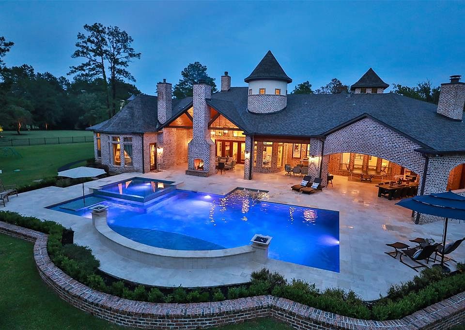 Stunning 1 story custom home on approximately 15 acres on High Meadow Ranch Golf course hole # 2. Over 1800 sq ft of covered lanai! Horses are allowed on this amazing property!