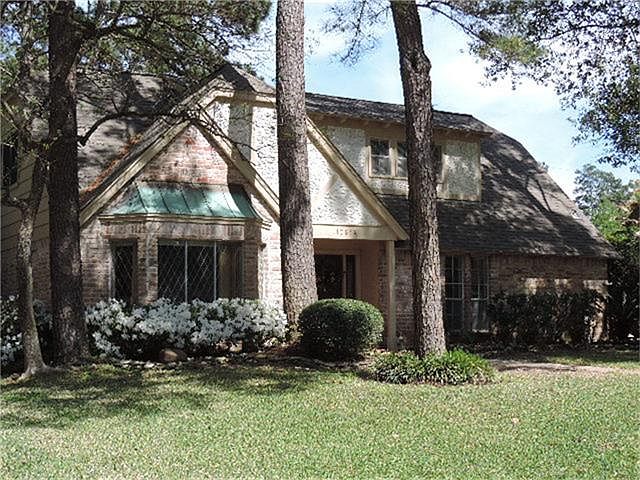Large freshly landscaped yard on a cul-de-sac street.