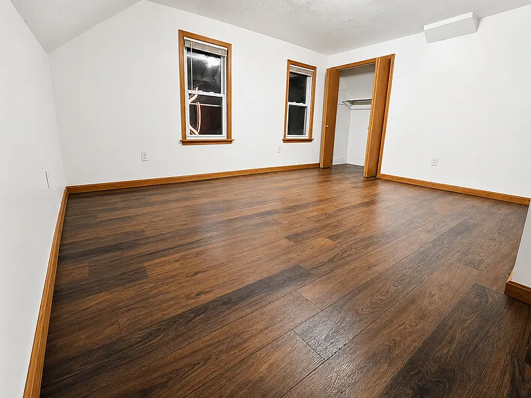 Spacious bedroom with updated flooring