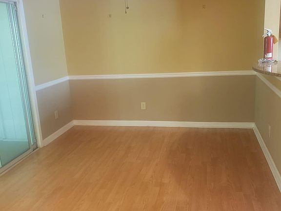 Dinning room area, with doors leading to enclosed sun room