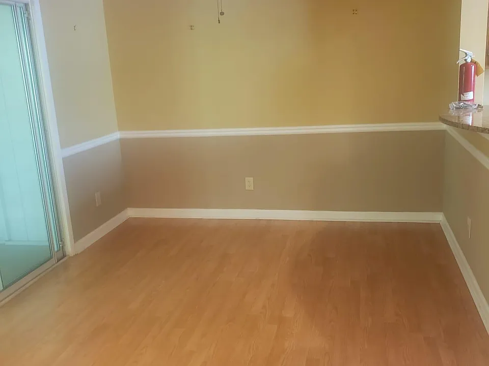 Dinning room area, with doors leading to enclosed sun room