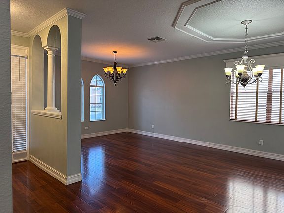 Bright and spacious living room featuring a modern open-concept layout, perfect for comfortable living and entertaining.