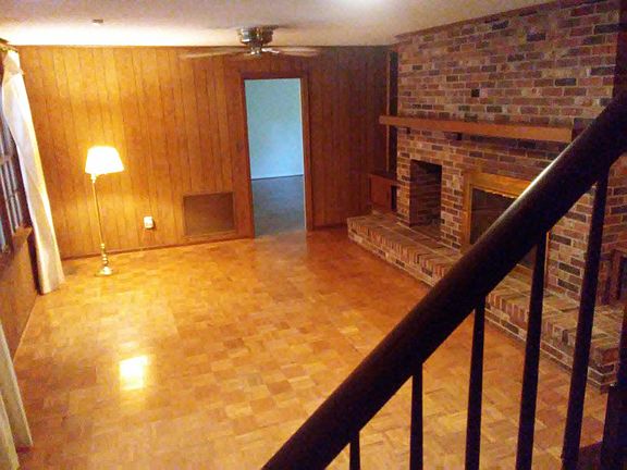 Large Den with wood burning fireplace, lots of built in cabinets