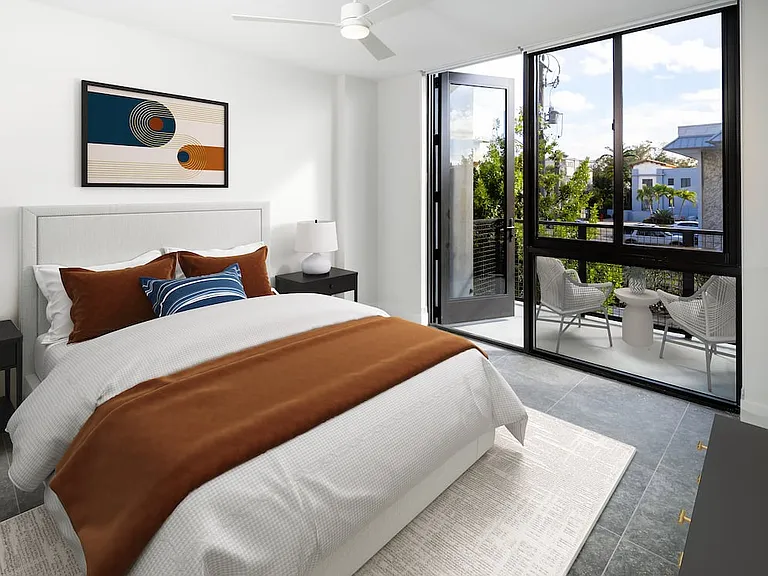 Signature Collection Townhome primary bedroom with balcony