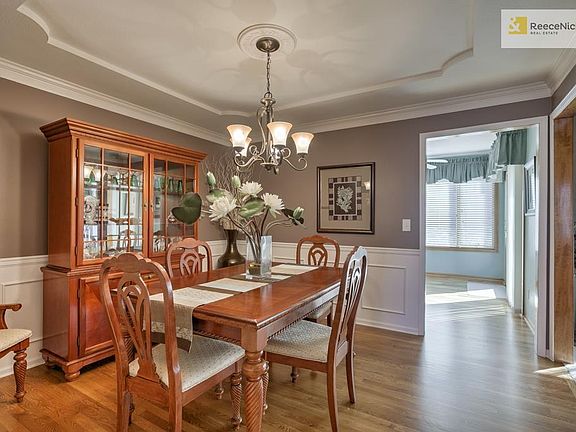 Dining with fresh paint and flawless wood floors.