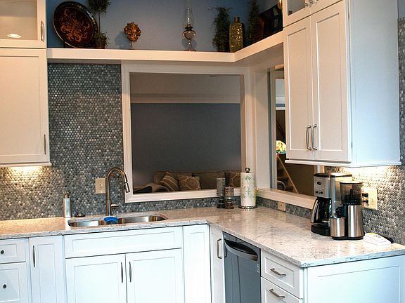 New kitchen - Appliances & Quartz Counter tops Kitchen is Light-filled and opens into Living Room
