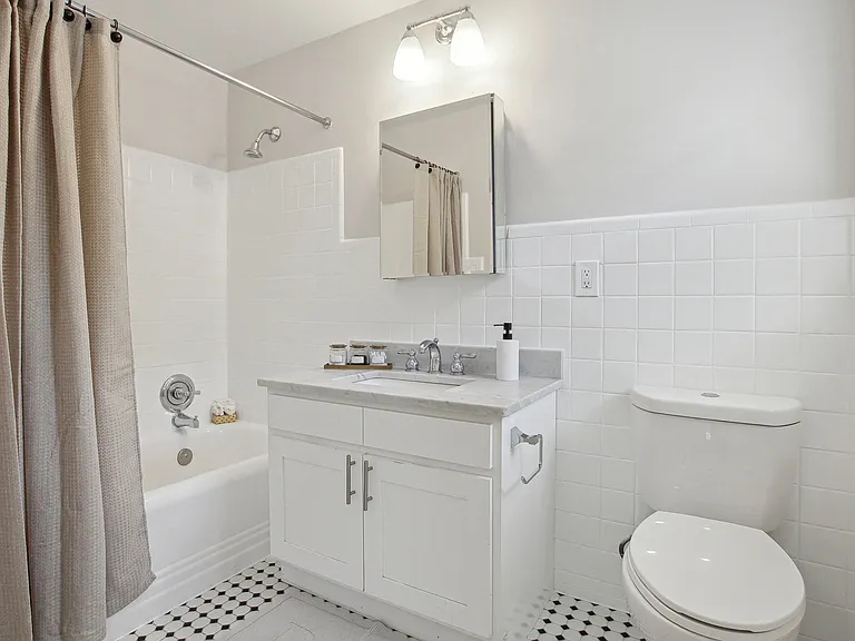 Bathroom with Ceramic Tile, Operable Window, and Deco Tub