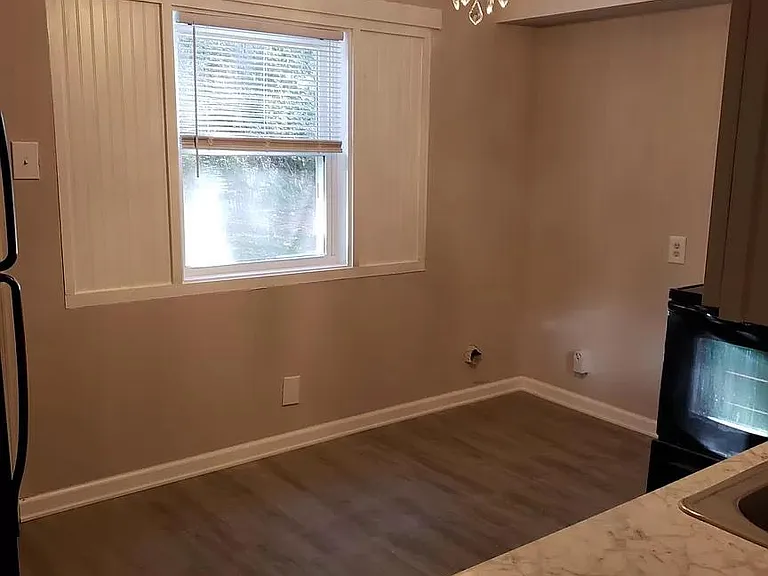 Eat-in Kitchen Dining Area with view of private, wooded backyard
