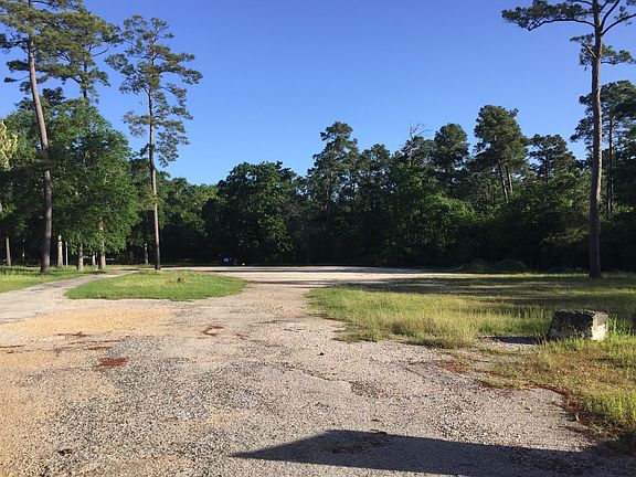 A large concreted parking lot and plenty of room to move lar