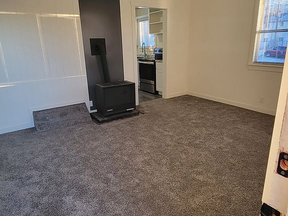 Front door open to living room