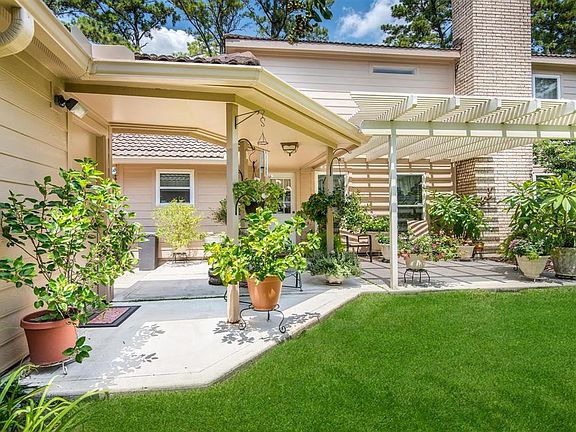 I love this Pergola and extra large patio. Just enough shade to enjoy coffee in the morning and watch your plants/flowers bloom!
