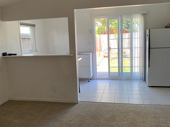 Sliding glass door leads to private deck area